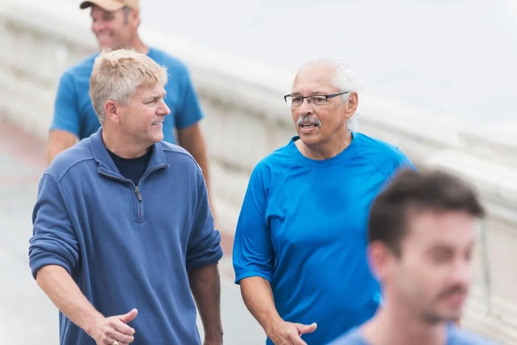 What is Walking and why is it good for your fitness - Multi-ethnic group of men walking
