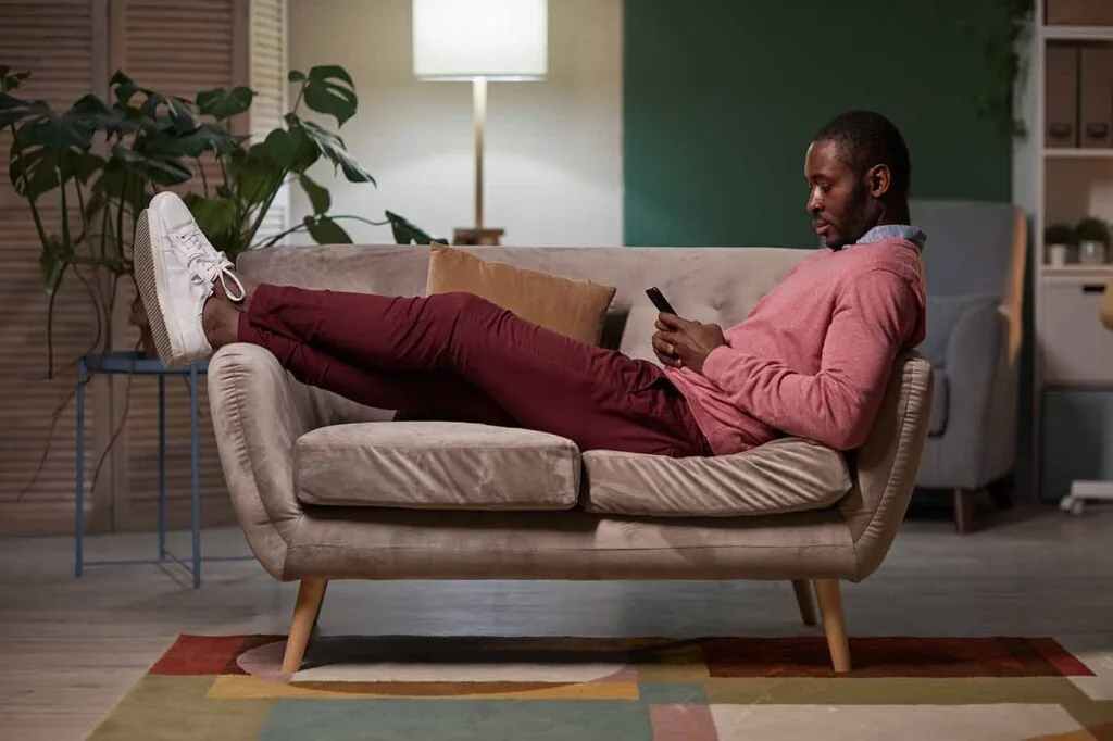 Man resting on sofa