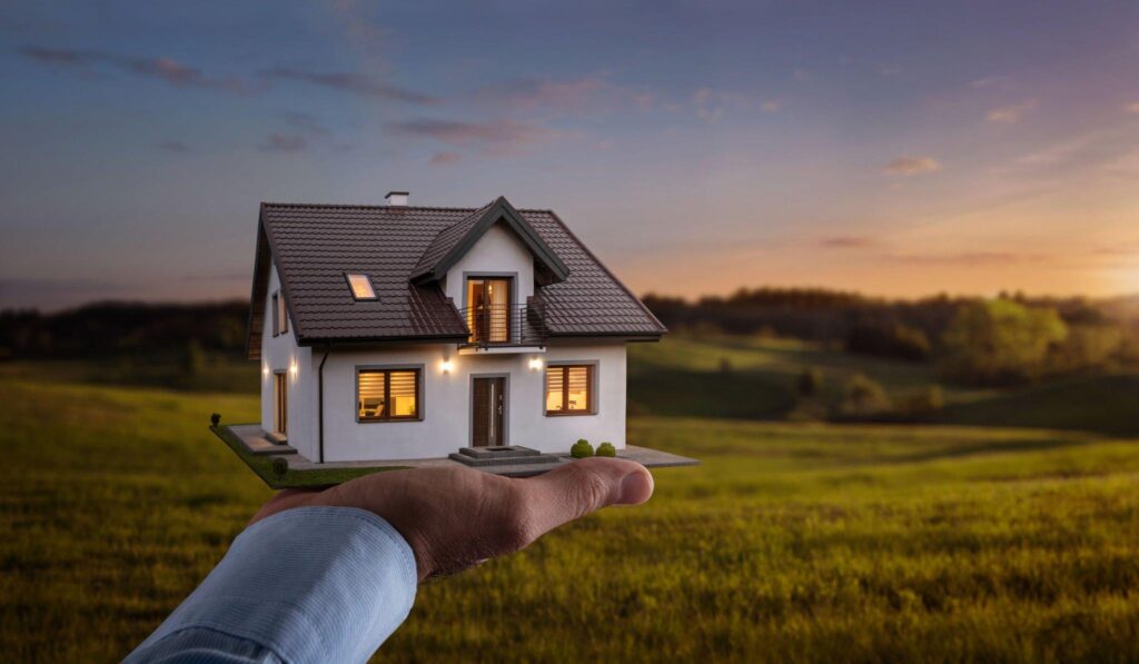 Buying a House Without a Loan - Concept of buying or building a new home. Male hand showing, offering a new dream house at the empty field